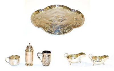 Lot 166 - A tray of silver items including an Edwardian quatrefoil dressing tray embossed with cherubs,...