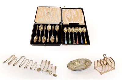 Lot 168 - A tray of silver items including a cased set of six Elizabeth II harlequin enamelled demitasse...
