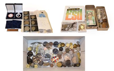 Lot 170 - A miscellany of coins, including a George V, 1911 sovereign mounted in a scroll bezel and suspended