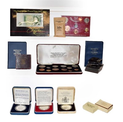 Lot 182 - A box of assorted British coins and coin sets, including commemorative crowns, pre and post...