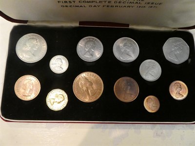 Lot 182 - A box of assorted British coins and coin sets, including commemorative crowns, pre and post...