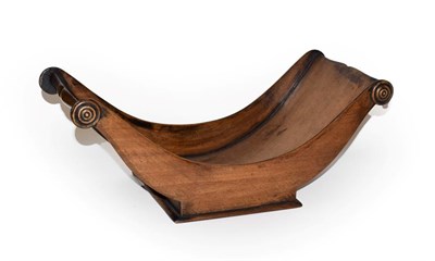 Lot 187 - A 19th century mahogany cheese coaster of dish form with scrolled handle, 46.5cm wide