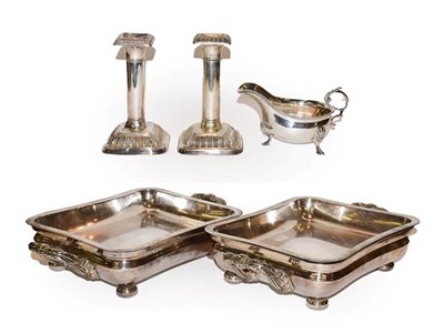Lot 195 - A pair of silver plated entree dishes, a pair of table candlesticks and a sauce boat