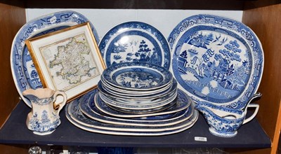 Lot 198 - A quantity of blue and white pottery mainly in the Willow pattern, including early 19th century...