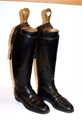 Lot 219 - A pair of leather riding boots, spurs and wooden boot trees, size 9