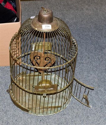 Lot 234 - An early 20th century brass wirework bird cage, 31.5cm diameter by 51cm high