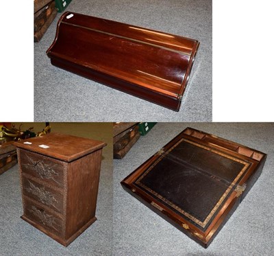 Lot 236 - A Victorian mahogany writing slope, a carved oak three height miniature chest and a mahogany scroll