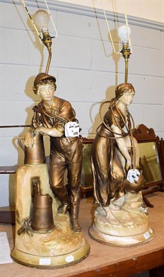 Lot 247 - A large pair of painted plaster figural lamps, probably Austrian, formed as figures, 67cm to...