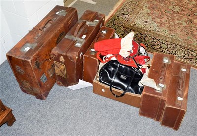Lot 257 - Five graduated tan leather suitcases and a quantity of vintage ladies handbags
