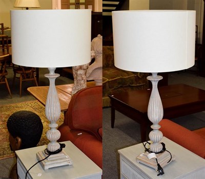 Lot 260 - A modern pair of large wooden table lamps, as light grey distressed effect reeded balusters on...