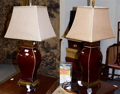 Lot 261 - A pair of sang de boeuf style table lamps, with brass effect mounts, 51.5cm high, together with...
