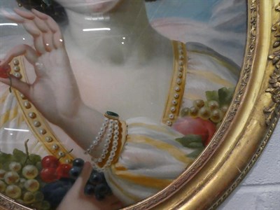 Lot 1019 - A pair of gilt framed reverse paintings on glass, portraits of maidens with fruit, 53cm by 44cm (2)
