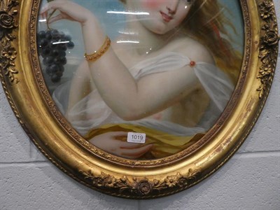 Lot 1019 - A pair of gilt framed reverse paintings on glass, portraits of maidens with fruit, 53cm by 44cm (2)