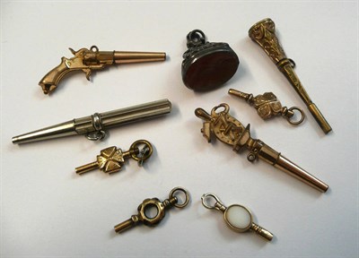 Lot 430 - Eight Watch Keys and a Fob Seal, including a novelty revolver watch key, seven other watch keys and