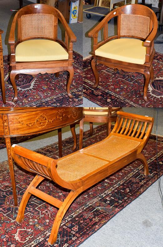 Lot 1063 - A pair of modern teak tub chairs with cane work panel 60cm by 56cm, 88cm high, seats 44cm high,...