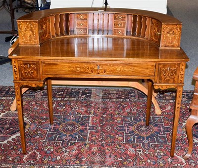 Lot 1064 - An American mahogany Carlton House style desk, with marquetry inlay, fitted superstructure and...
