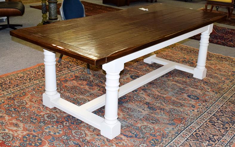 Lot 1065 - A modern oak farmhouse dining table, pegged plank top with painted base, Peter Thompson of...