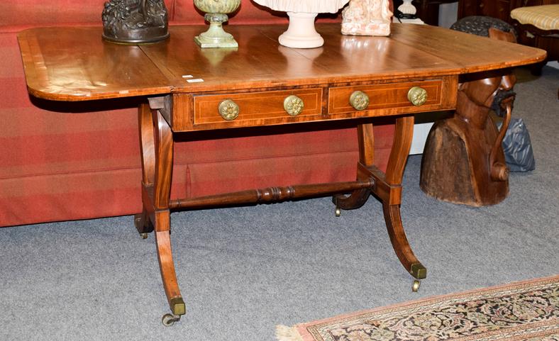 Lot 1075 - A 19th century crossbanded mahogany sofa table, 83cm by 77cm by 70cm high