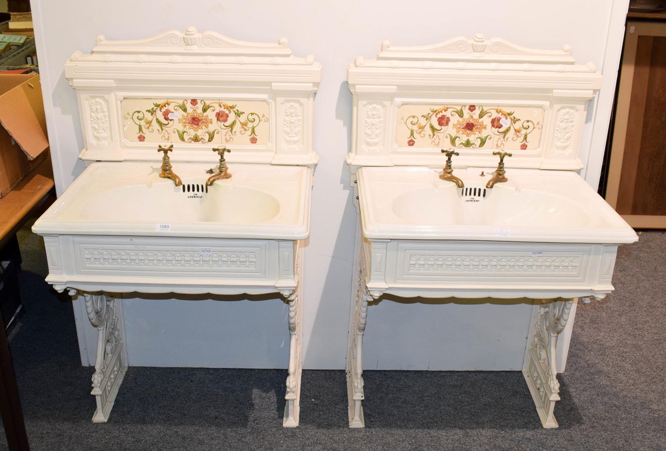 Lot 1085 - A pair of Victorian ladies and gents wash basins on painted cast iron stands with tiles...