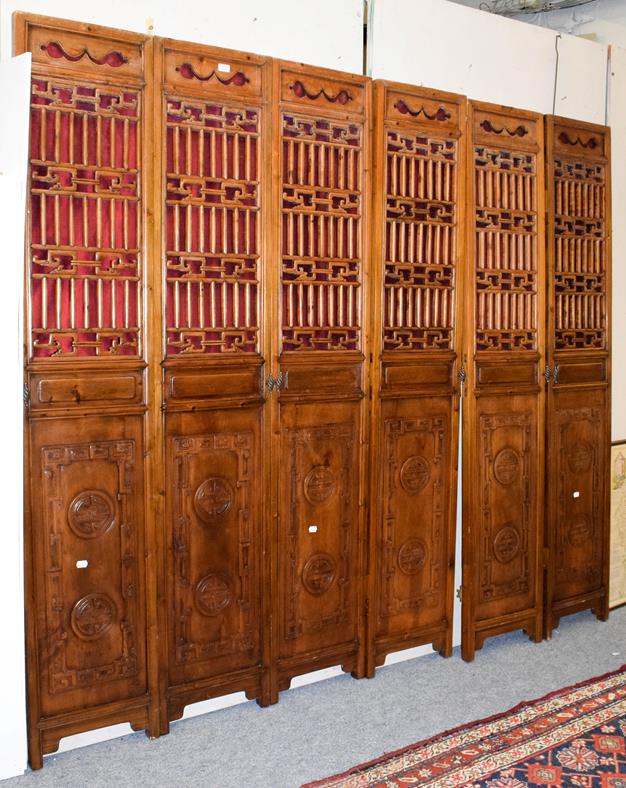 Lot 1089 - Six Chinese carved wood doors/panels, each 210cm by 39cm (6)