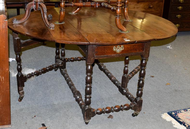 Lot 1092 - A joined oak six-to-eight-seater gateleg dining table, circa 1720, with oval drop leaves above...