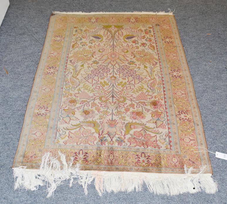 Lot 1099 - Indian prayer rug, the cream field with Tree of Life, surrounded by birds enclosed by...