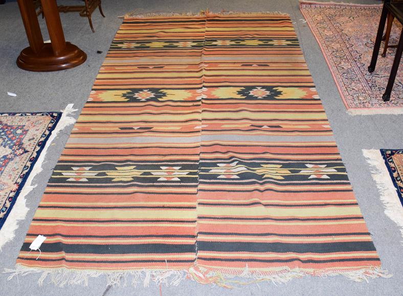 Lot 1109 - Anahobliac Kilim woven in two halves and joined, the polychrome field of geometric device 278cm...