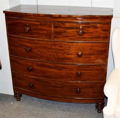 Lot 1119 - A Victorian mahogany bow-front chest of drawers, raised on turned feet, 115cm by 54cm by 116cm high