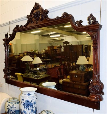 Lot 1120 - An imposing carved mahogany over-mantel mirror, with scroll work pediment, 206cm by 136cm high