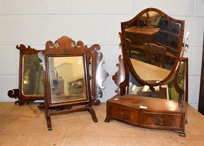 Lot 1127 - Two Georgian mahogany fret mirrors, a similar dressing table mirror and a mahogany two-drawer...