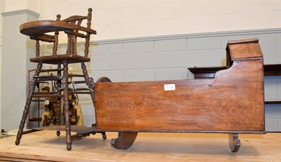 Lot 1134 - A 19th century doll's cradle and a metamorphic high chair (2)