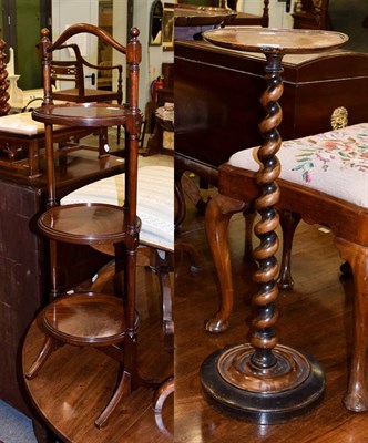 Lot 1147 - A Victorian mahogany three tier cake stand, 93cm high, together with a walnut inlaid torchere...