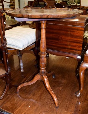Lot 1148 - A 19th century mahogany snap-top pedestal tripod table, with scalloped dish top, 57cm by 75cm high
