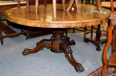 Lot 1152 - A Victorian mahogany breakfast table on reeded baluster column and carved paw feet, 133cm...