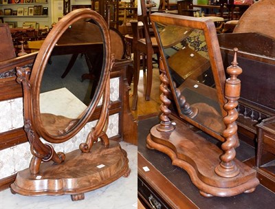 Lot 1154 - A Victorian mahogany oval dressing table mirror on scroll supports, 83cm high together with two...