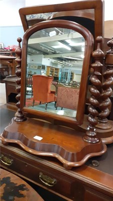 Lot 1154 - A Victorian mahogany oval dressing table mirror on scroll supports, 83cm high together with two...