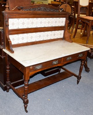Lot 1155 - A Victorian mahogany washstand, marble top and with tiled splash-back, 123cm by 57cm by 130cm high