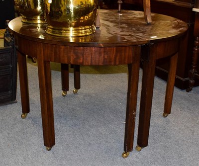 Lot 1156 - A pair of 19th century mahogany D-end tables, with brass castors, (formerly a dining table),...