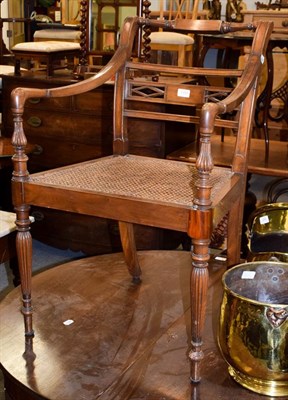 Lot 1157 - A Regency mahogany open armchair, with canework seat and reeded supports, 56cm wide, 52cm deep,...