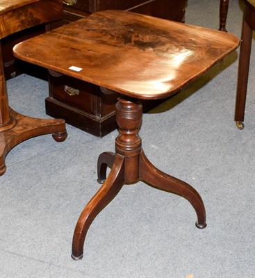 Lot 1160 - A George III mahogany snap top tripod table, with turned pedestal and scroll supports, 60cm by 56cm