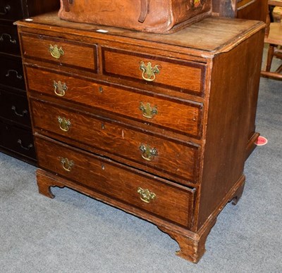 Lot 1170 - A George III four-height crossbanded oak chest of drawers, 84cm by 47cm by 82cm high