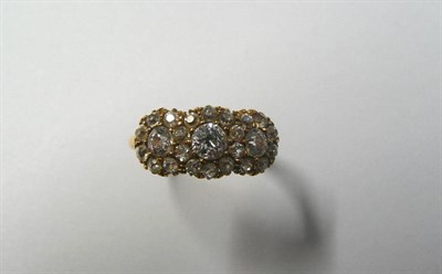 Lot 444 - An 18 Carat Gold Diamond Triple Cluster Ring, old cut diamonds in yellow claw settings to a...