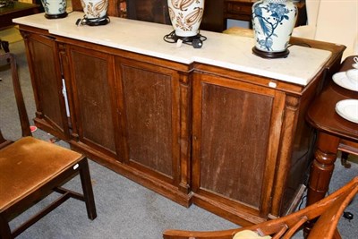 Lot 1174 - A Victorian mahogany breakfront sideboard with marble top, with panelled doors and square...
