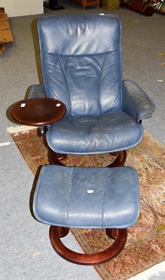 Lot 1177 - A blue leather Stressless armchair and footstool