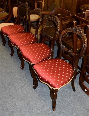 Lot 1191 - A set of four Victorian carved walnut salon chairs, raised on scroll supports
