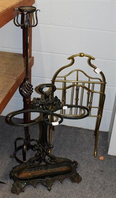 Lot 1214 - An Edwardian brass magazine rack, stamped Hall, 80cm high, a cast iron stick stand and a...