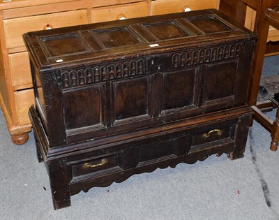 Lot 1215 - A period oak coffer on an associate two-drawer stand, 105cm by 43cm by 70cm