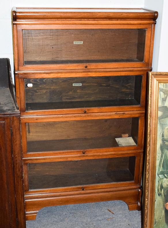 Lot 1217 - A Globe Wernicke mahogany four-tier bookcase, labelled, 87cm by 27cm by 142cm high