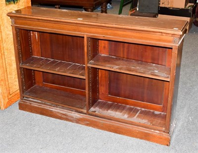 Lot 1233 - A Regency mahogany open double bookcase with adjustable shelves, 143cm by 30cm by 92cm high,...