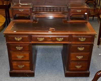 Lot 1235 - A Victorian walnut twin-pedestal desk, with raised superstructure and leather top, 121cm by 67cm by